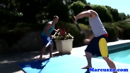 Gay Muscular Jocks Sword Fighting By The Pool free video